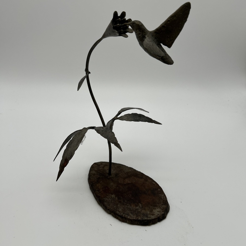 handcrafted rustic metal art sculpture features a hummingbird